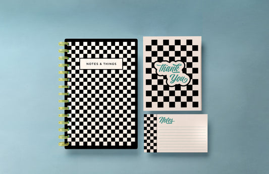 This gift set includes black and white checkerprint notecards, an A5 hardcover spiral notebook with a blank interior, and a matching set of thank you cards. The cohesive design ties all items together, making it a perfect gift for anyone who appreciates stylish and coordinated stationery