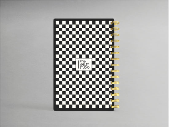 Enhance your note-taking experience with this sophisticated A5-sized hardcover spiral bound notebook, showcasing an elegant black and white checkerprint design. Accented with a luxurious gold spiral, its interior boasts blank pages, offering versatility for sketches, notes, or creative projects.